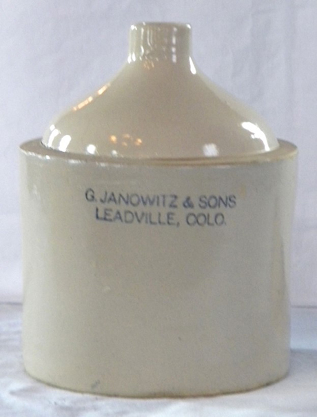 The Janowitz company was not a distiller of alcohol, but rather a distributor of the liquor purchased from producers. A jug like this was fabricated separately and made available for the consumer, which was filled from a wood barrel containing whiskey or some other liquor in stock.