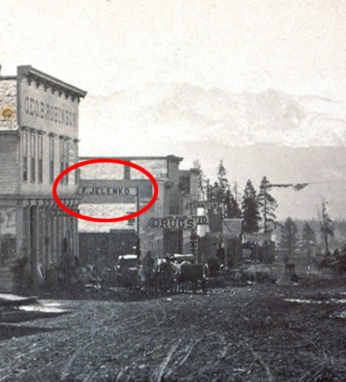 Detail of the stereoview showing the painted sign of “F. Jelenko” off the corner of the Robinson building.
