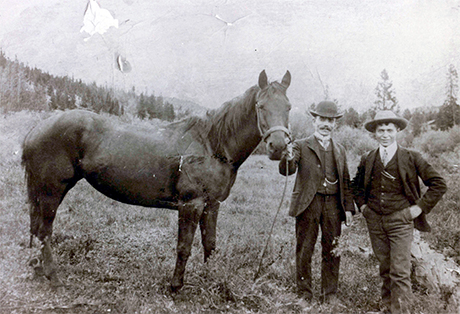 Photo of Maurice Stager with Hyman Isaacs (holding horse), circa 1904.