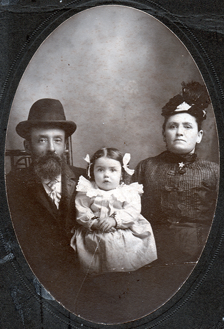 This 1902 or 1903 photograph shows Helen Walpensky as a baby seated with Herman and Hanna Oliner, her maternal grandparents.